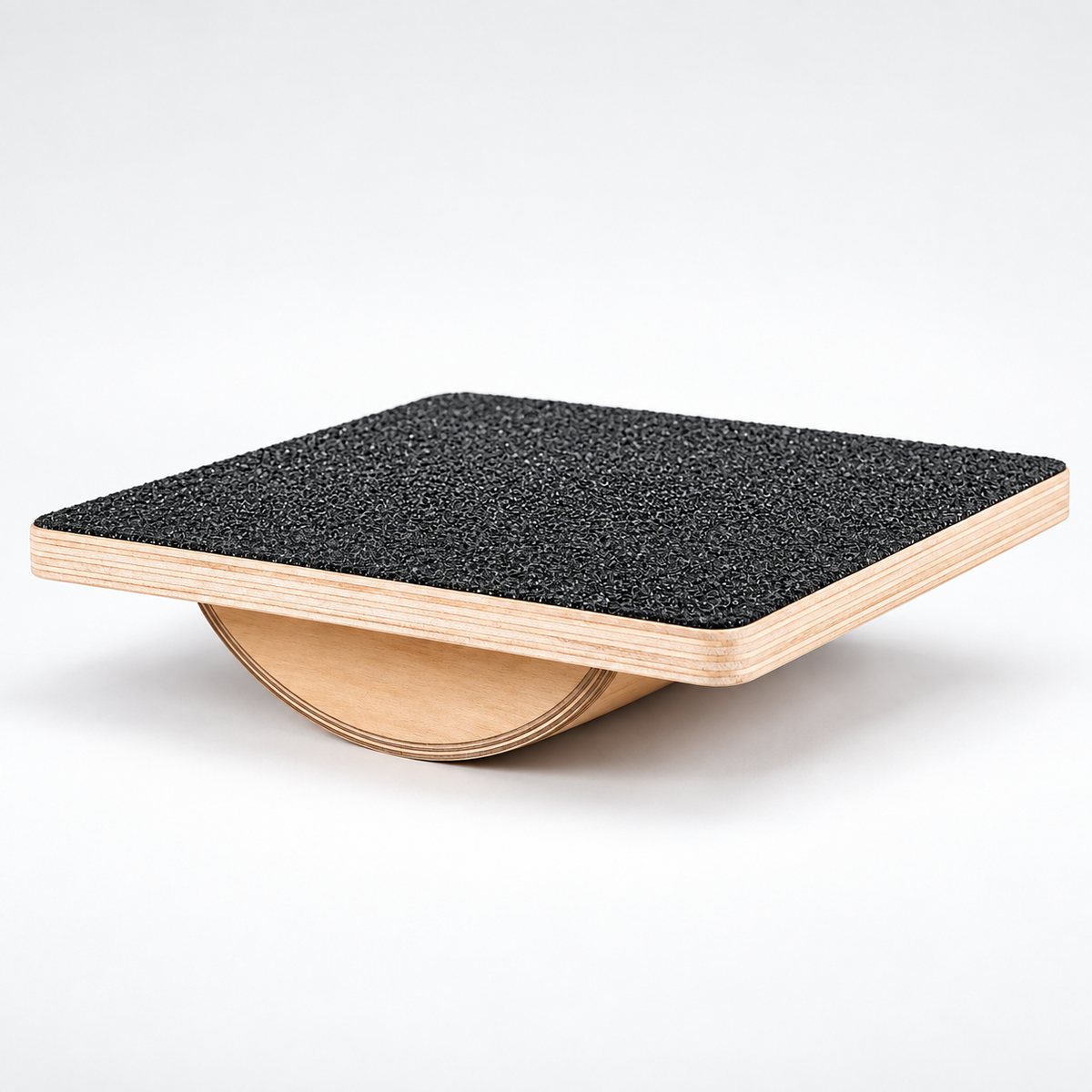 Wooden balance board showing layered plywood and curved rocker base